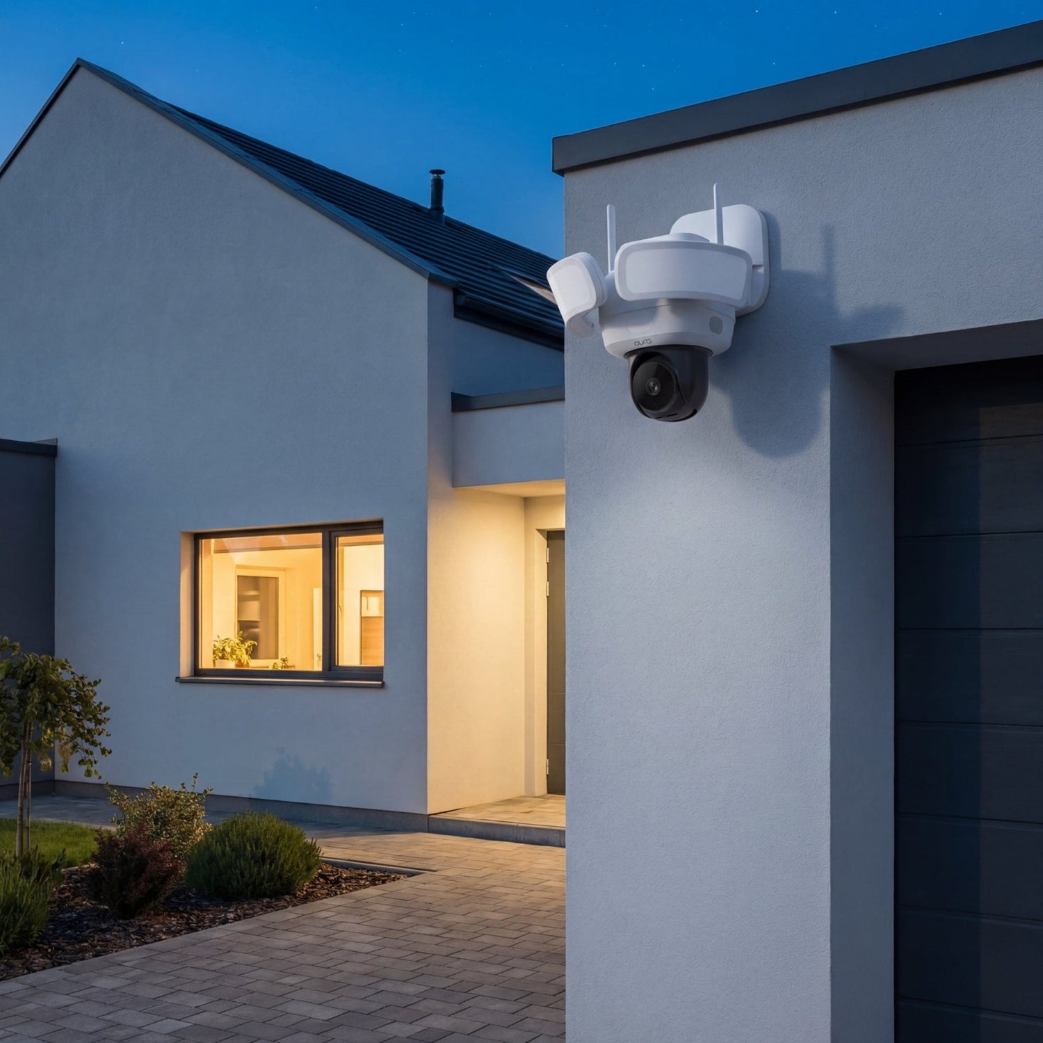 Security camera on a modern house exterior at night